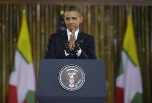 U.S. President Barack Obama puts his hands together after the conclusion of his speech at Yangon University's Convocation Hall in Yangon, Myanmar, Monday, Nov. 19, 2012.