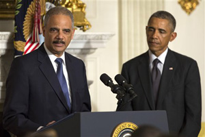 President Barack Obama, right, looks on as Attorney General Eric Holder speaks in the State Dining Room of the White House, on Thursday, Sept. 25, 2014, in Washington. Holder, who served as the public face of the Obama administration's legal fight against terrorism and weighed in on issues of racial fairness, is resigning after six years on the job. He is the first black U.S. attorney general.