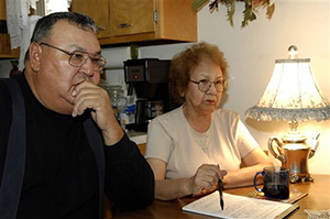 In this Nov. 10, 2009 file photo, George and Marilyn Keepseagle talk about the lawsuit, at their kitchen table, in Fort Yates, N.D. American Indian groups are fighting a plan to create a charitable foundation with almost $400 million in federal dollars left over from a 2010 government discrimination settlement. A federal judge will review the matter Tuesday.
