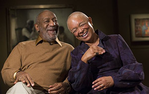 In this photo taken Nov. 6, 2014, entertainer Bill Cosby and his wife Camille share a laugh as they tell a story about collecting one of the pieces in the upcoming exhibit, Conversations: African and African-American Artworks in Dialogue, at the Smithsonian's National Museum of African Art in Washington.