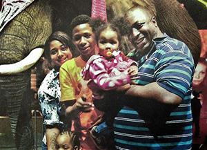 In this undated family file photo provided by the National Action Network, Eric Garner, right, poses with his children during a family outing. According to a lawyer for the victim’s family, a New York City grand jury on Wednesday, Dec. 3, 2014 cleared a white police officer in the videotaped chokehold death of the unarmed Garner, who had been stopped on suspicion of selling loose, untaxed cigarettes.
