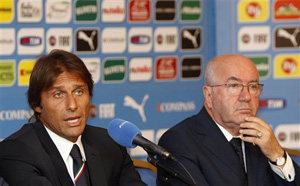 Italian national soccer team's new coach Antonio Conte, left, flanked by Italian Soccer Federation (FIGC) President Carlo Tavecchio, speak during a press conference for his presentation, in Rome, Tuesday, Aug. 19, 2014.
