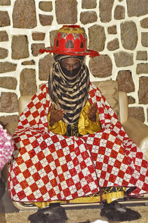 Traditional ruler Lamido Sanusi takes part in a prayer meeting Wednesday, June 11, 2014, at Kano State Government house in Kano, Nigeria. Lamido Sanusi was appointed on Sunday, June 8, 2014, as the new emir of Kano, replacing Emir Ado Bayero who died at age 83.