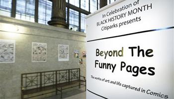 In this Wednesday, Feb. 5, 2014 photo, an exhibit at the City/County building in downtown Pittsburgh is highlighting early artists who helped break the comic book color barrier by featuring black characters and a publisher who started to break the comic color barrier in the 1930s and 1940s.