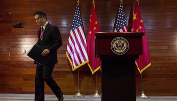 Gary Locke, the outgoing U.S. ambassador to China, leaves after a farewell news conference held at the U.S. Embassy in Beijing. A major Chinese government news service used a racist slur to describe Locke in a mean-spirited editorial on Friday that drew widespread public condemnation in China.