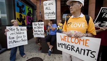 This July 18, 2014, file photo shows protestors in Philadelphia demonstrating near the Consulate of Mexico in support of immigrants recently entering the United States via Mexico. For Republican Rep. Scott Perry of Pennsylvania the influx of Central American children who have crossed illegally into the United States has propelled immigration to a top concern for voters in his heavily rural district far from the Mexican border, eclipsing the new health care law and the federal deficit.