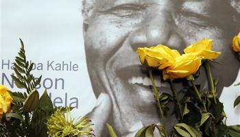 A portrait former president Nelson Mandela, placed outside his residence in Johannesburg, South Africa, Monday, Dec. 9, 2013. Mandela died Thursday Dec. 5 at his Johannesburg home after a long illness. He was 95.