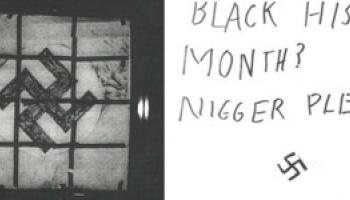 Swastika flag, note saying "Black History Month, Nigger Please"