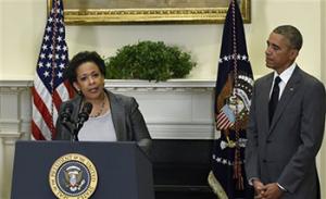 President Barack Obama listens as U.S. Attorney Loretta Lynch speaks after Obama nominated Lynch to be the Attorney General, Saturday, Nov. 8, 2014, in the Roosevelt Room of the White House in Washington. Lynch would succeed Attorney General Eric Holder.