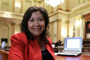 In this Aug. 28, 2014 file photo, California state Sen. Norma Torres, D-Pomona, poses in the Senate Chambers at the Capitol in Sacramento. Torres, a first-time candidate for Congress, tells voters there is no more critical time to vote than now _ even as she accepts that “great disillusion” might prompt many Hispanic voters to sit this non-presidential midterm election out.