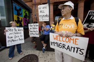 This July 18, 2014, file photo shows protestors in Philadelphia demonstrating near the Consulate of Mexico in support of immigrants recently entering the United States via Mexico. For Republican Rep. Scott Perry of Pennsylvania the influx of Central American children who have crossed illegally into the United States has propelled immigration to a top concern for voters in his heavily rural district far from the Mexican border, eclipsing the new health care law and the federal deficit.