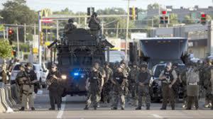 Law enforcement in Ferguson, Missouri has brought out military gear to control the protest that is occurring as a result of the death of the unarmed teen, Michael Brown.